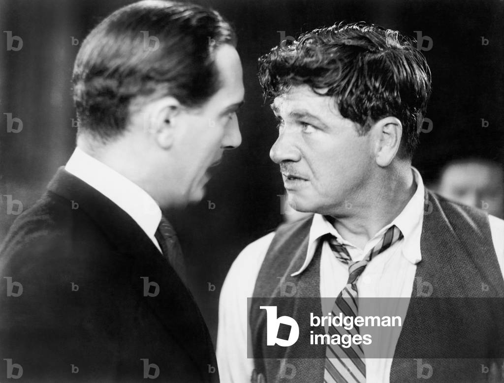 Two Men Looking Angrily at Each Other