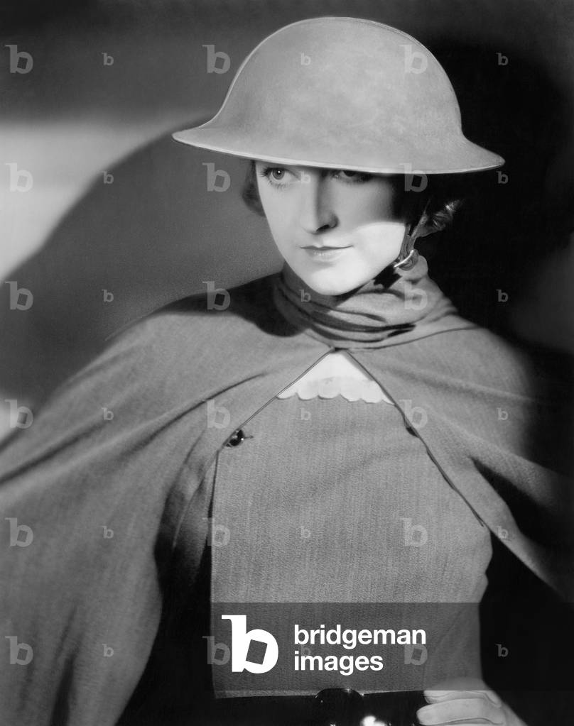 Woman in an Army Helmet and Uniform