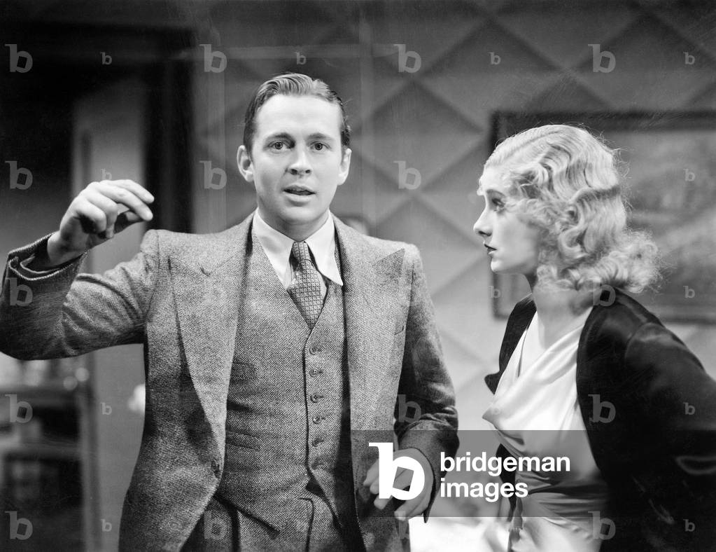 Man Trying to Explain Something to a Young Woman Who is Listening