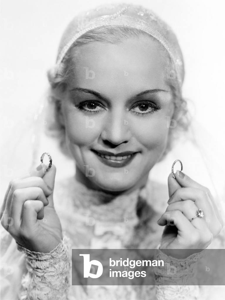 Happy Bride Holding Wedding Rings