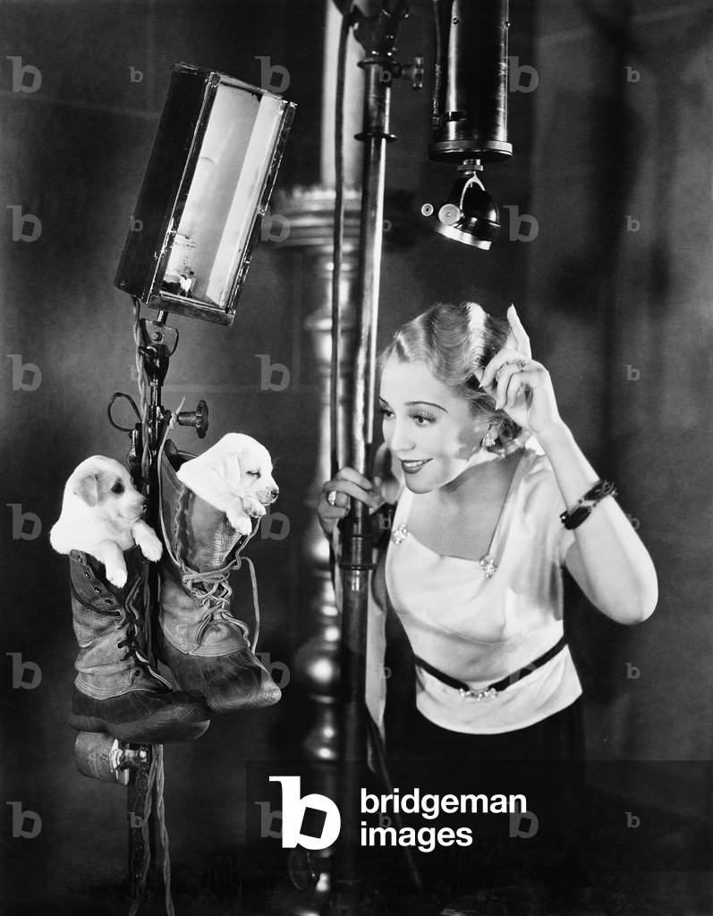 Woman on Movie Set with Puppies