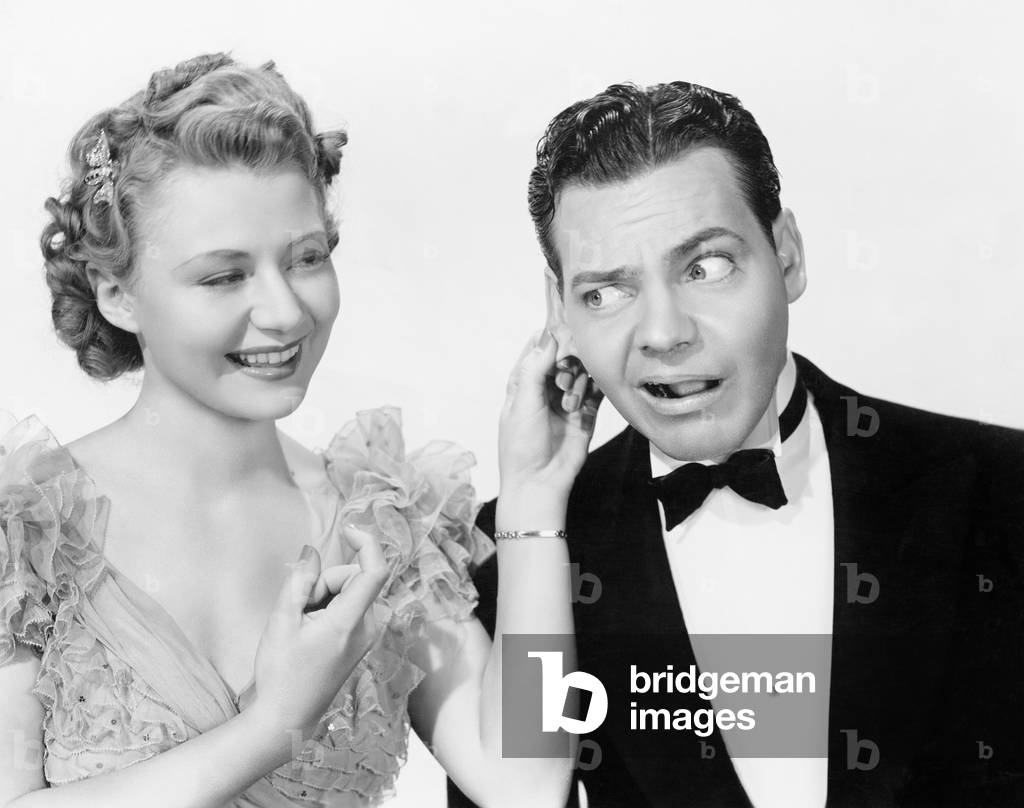 Woman Pulling a Man's Ear