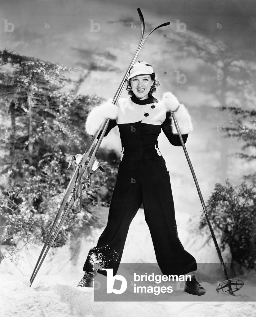 Portrait of a Young Woman Skiing and Smiling