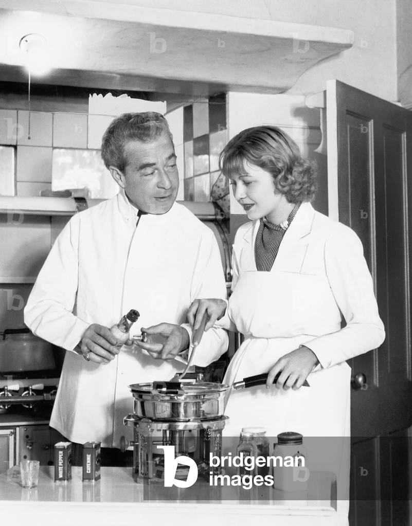 Couple Together in the Kitchen Preparing a Fondue