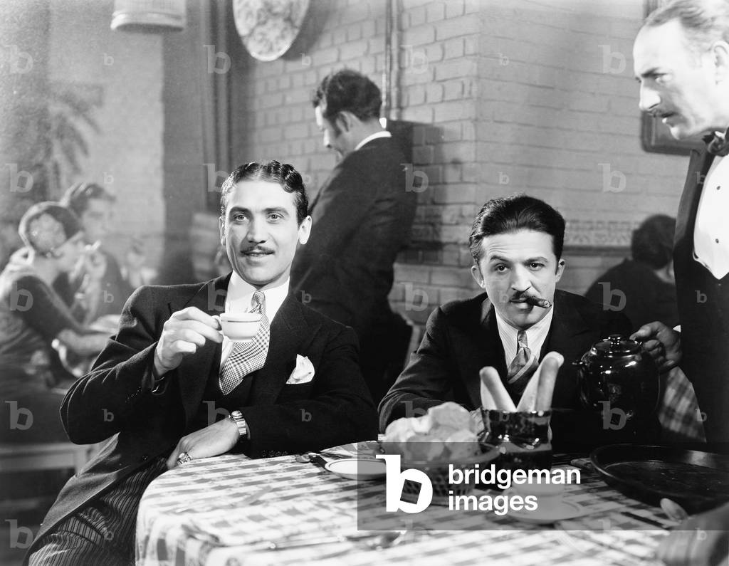 Two Men Sitting Together at a Restaurant