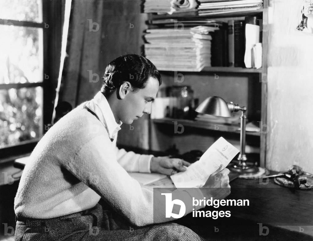 Profile of a Young Man Reading a Paper at his Desk