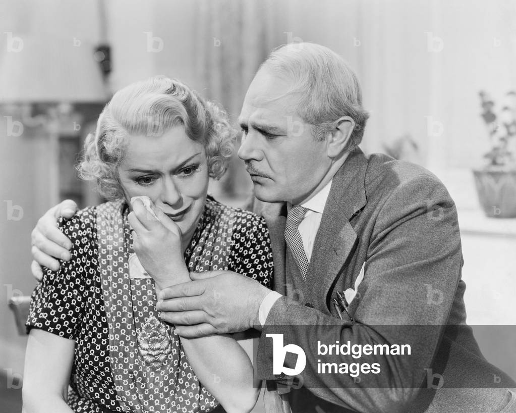 Man Consoling Crying Woman