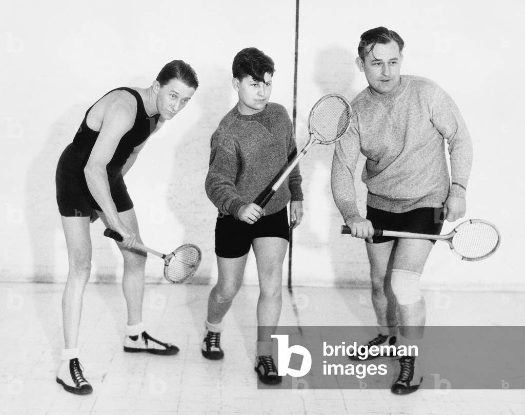 Three Men Playing Squash