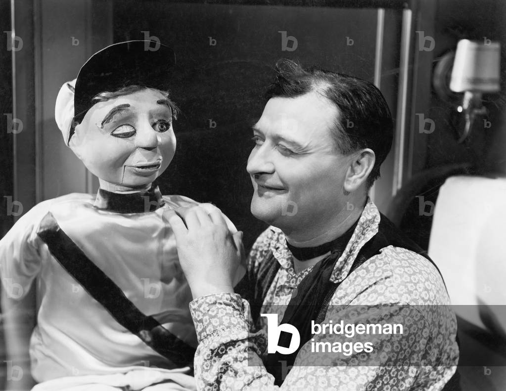 Man Talking and Looking with his Puppet