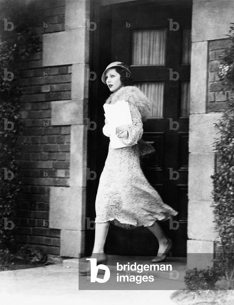 Young Woman Walking Out Door