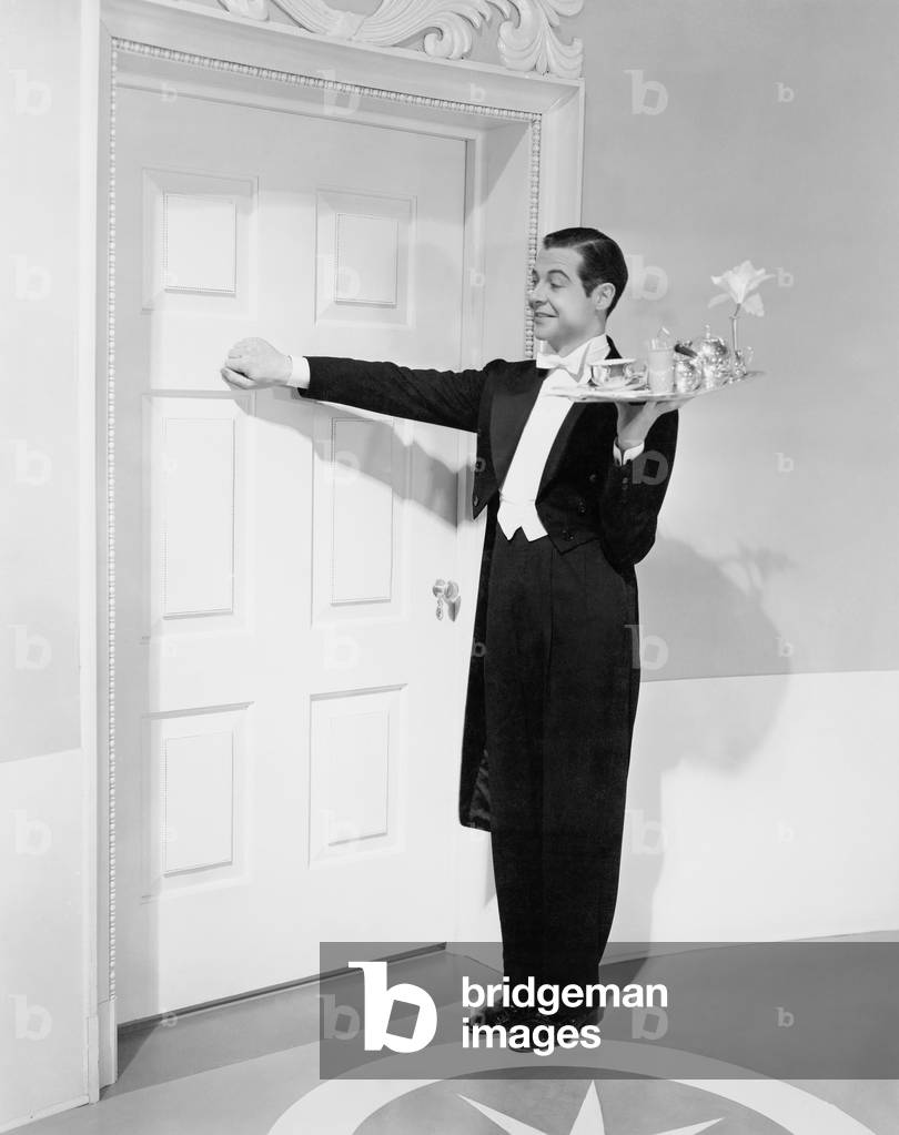Waiter with Tray Knocking on a Door