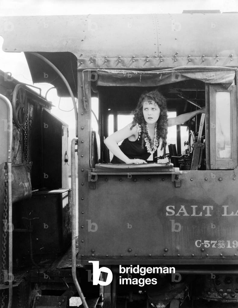 Woman looking out train window