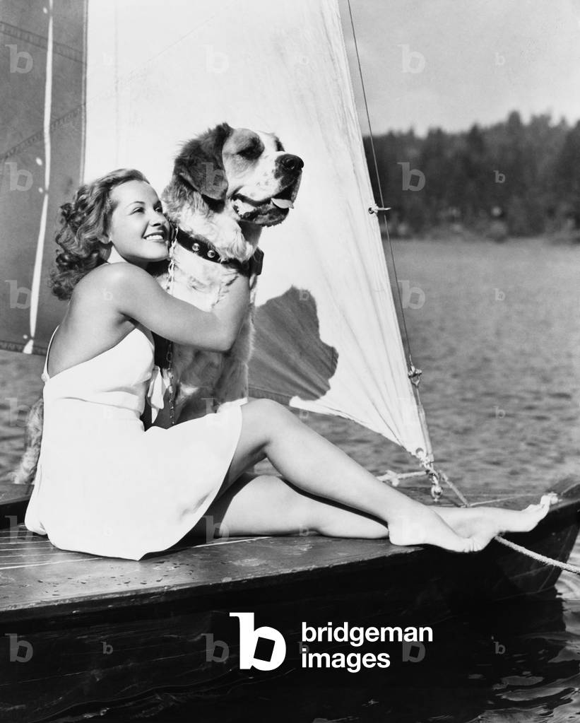 Woman and Dog on Sailboat