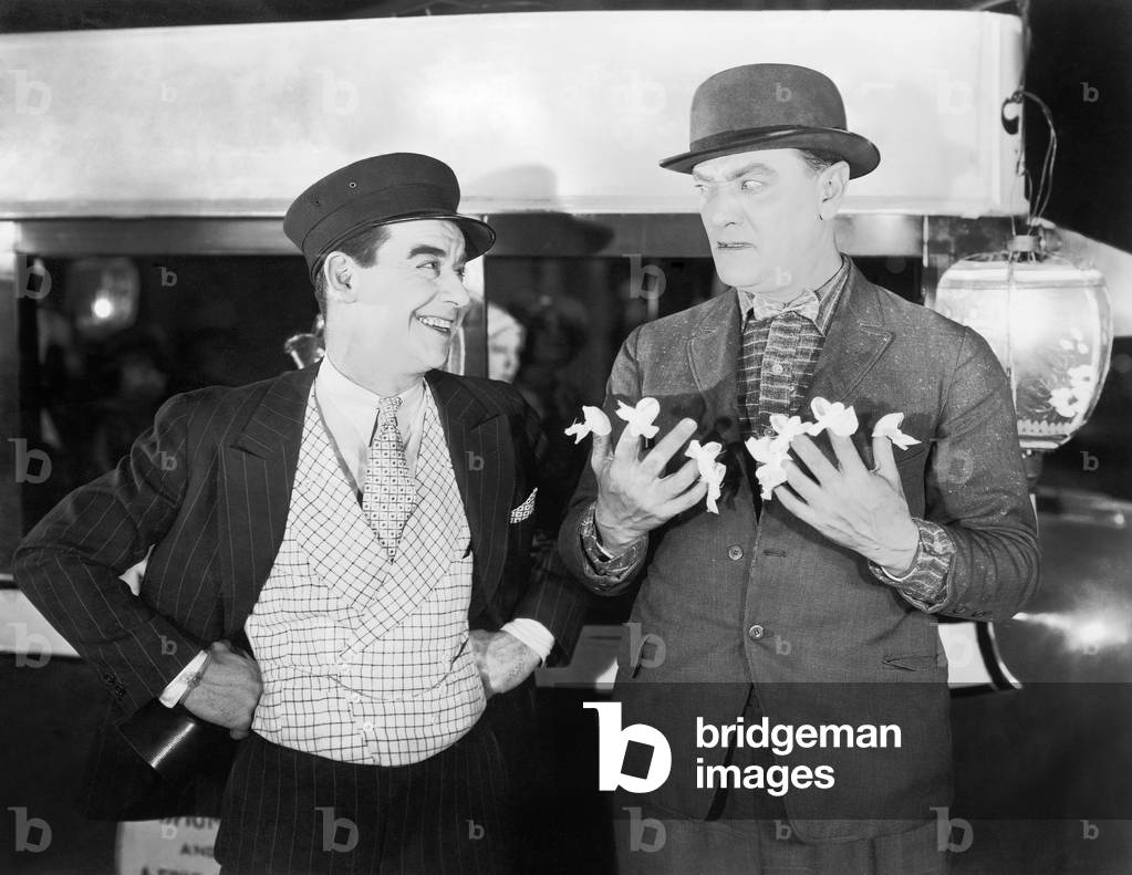 A Conductor and Businessman with Ribbons Tied to Nine Fingers