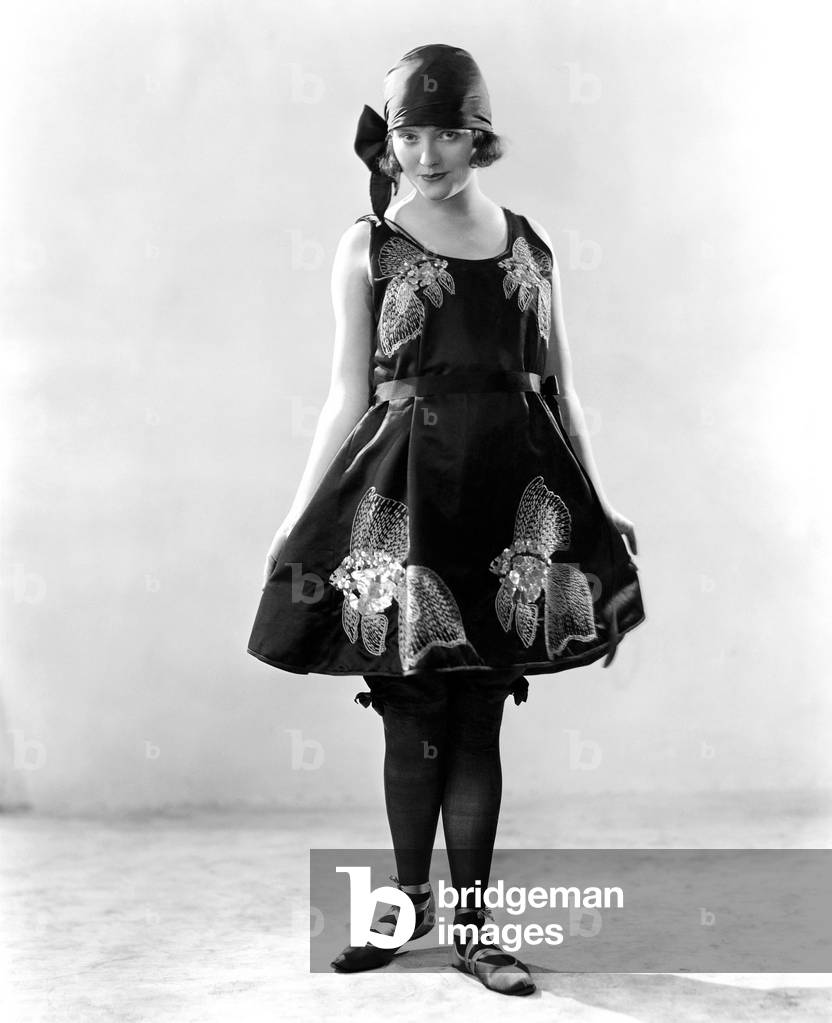 Woman in a Flowered Dress and Ballerina Shoes