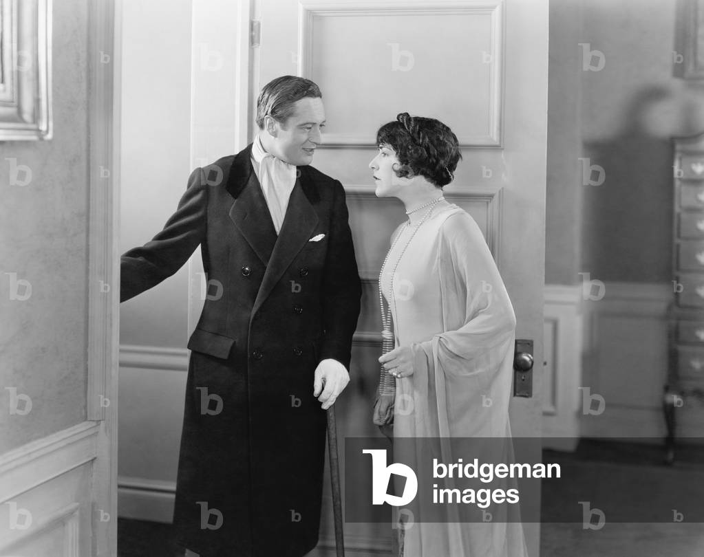 Elegant Couple Standing in the Doorway