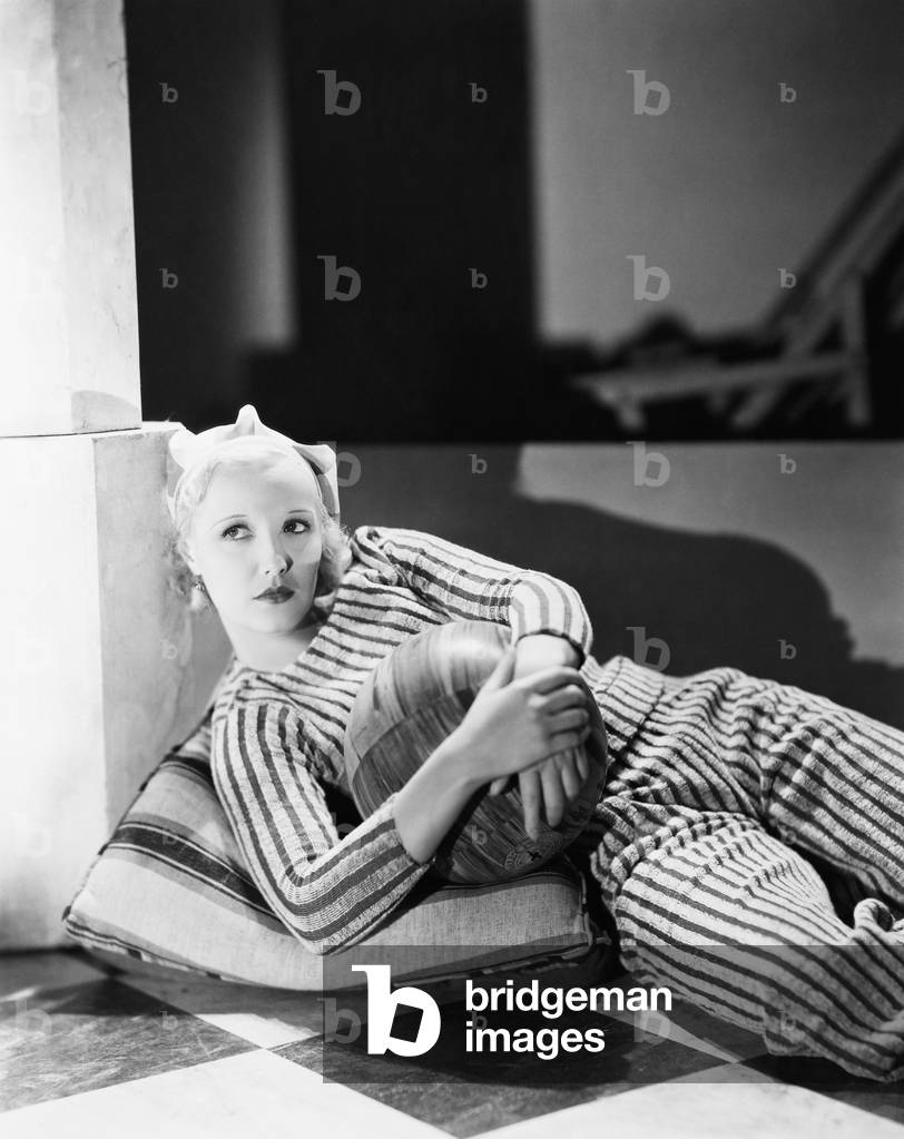 Portrait of Woman Holding Ball Lying on Floor