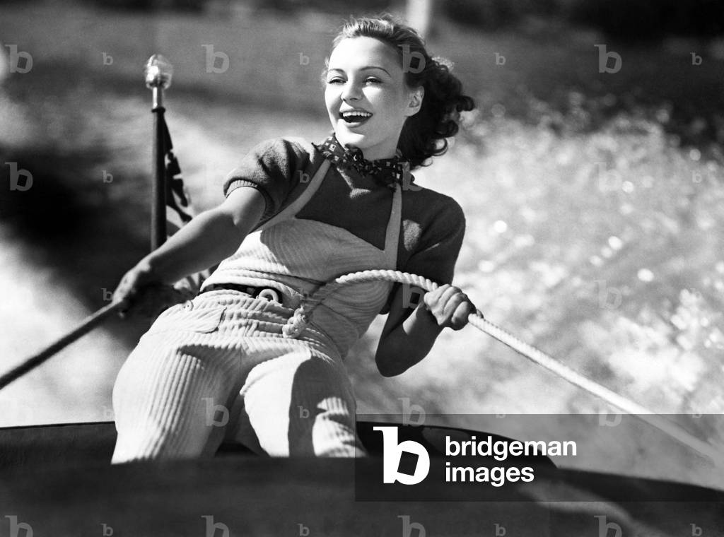 Woman Holding on to a Rope on a Sailboat