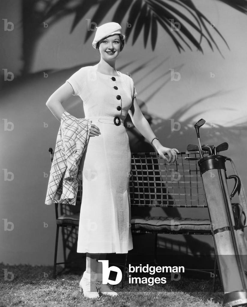 Woman Posing with Golf Clubs