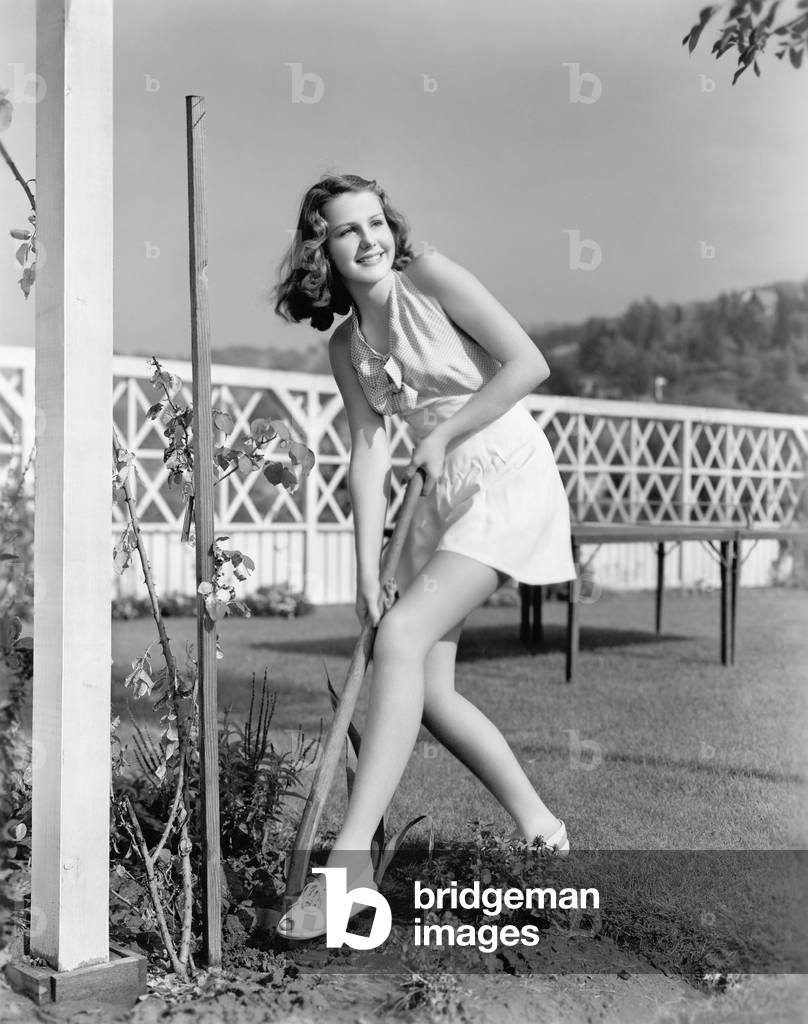 Young Woman in a Garden Doing Gardening