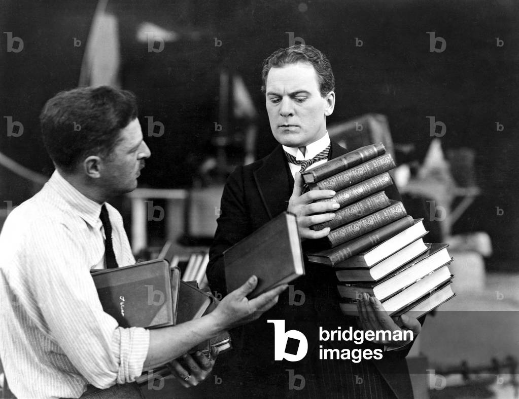 Men with Stacks of Books