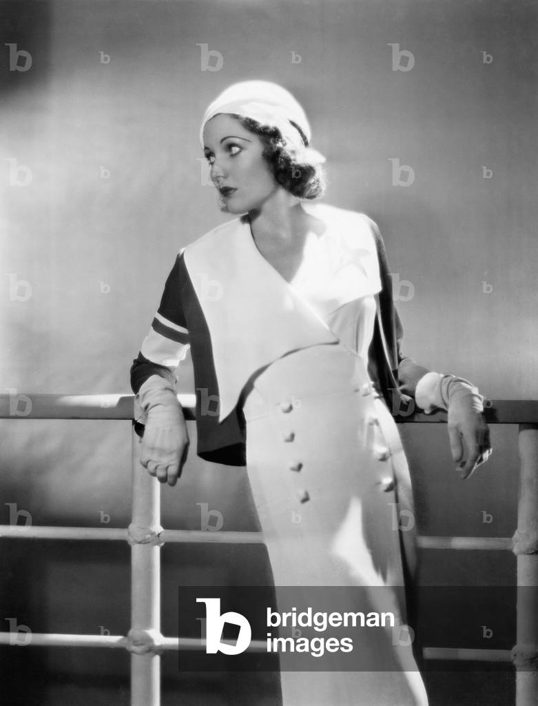 Woman Leaning Against Railing