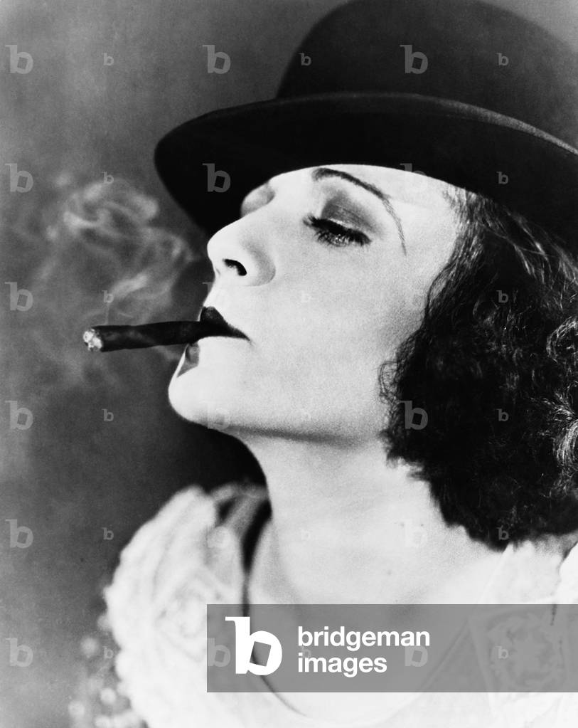 Portrait of a Young Woman with a Hat Smoking a Cigar