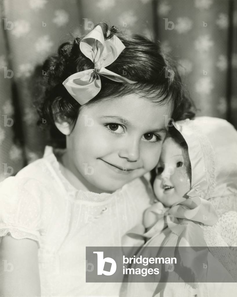 Little girl posing with her doll - (ov303)