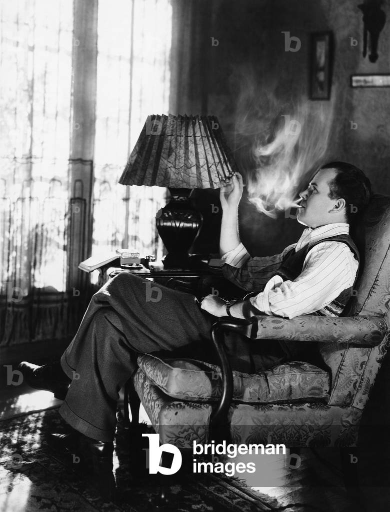 Man Smoking in Living Room