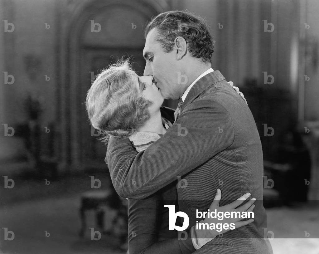 Couple Embraced and Kissing Each Other