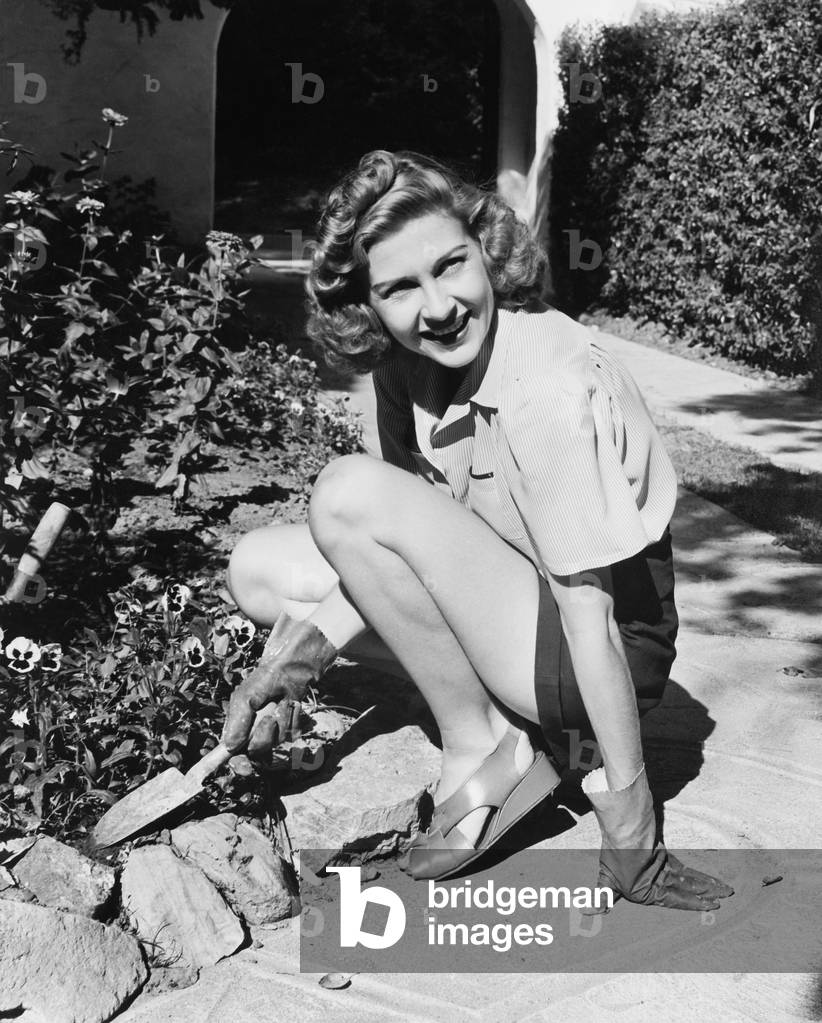 Young Woman in a Garden Doing Gardening