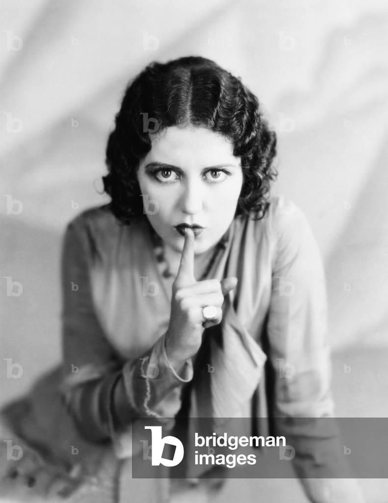 Portrait of Woman Shushing