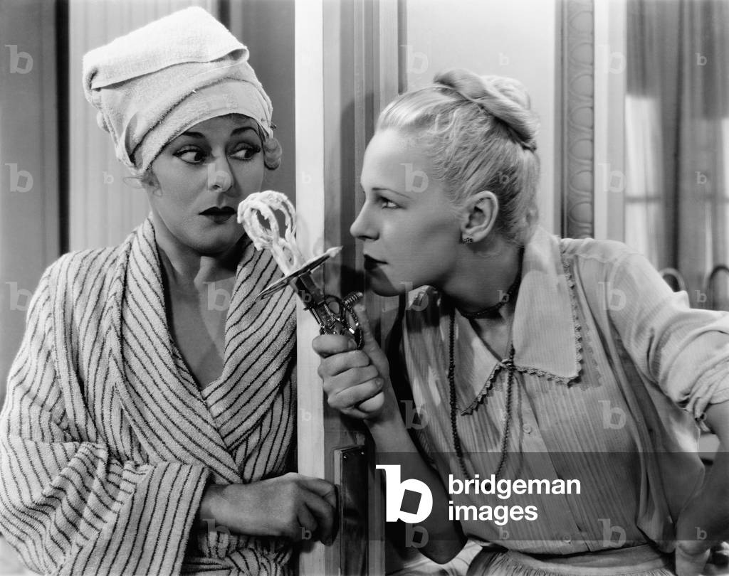 Woman Threatening Another Woman with Eggbeater