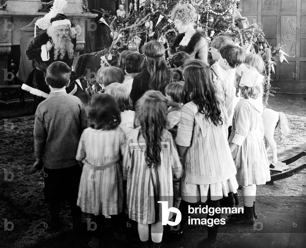 Santa Claus Visiting with Large Group of Children