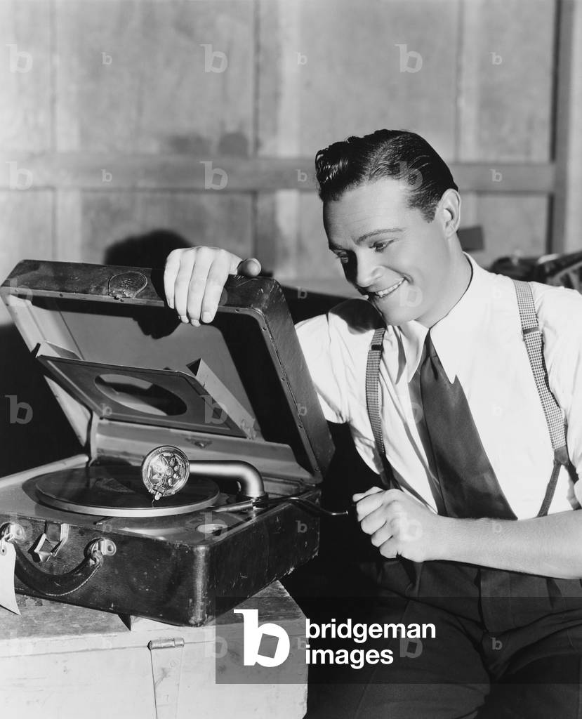 Man Listening to Record Player