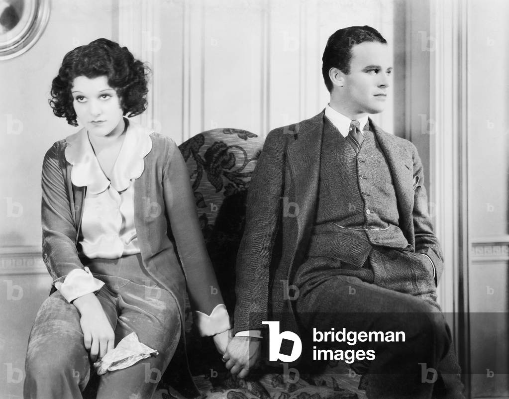Couple Sitting Together Holding Hands