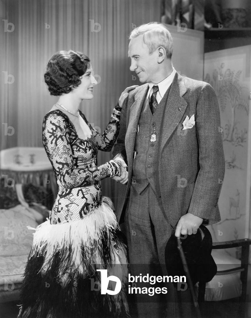 Woman Greeting an Older Man