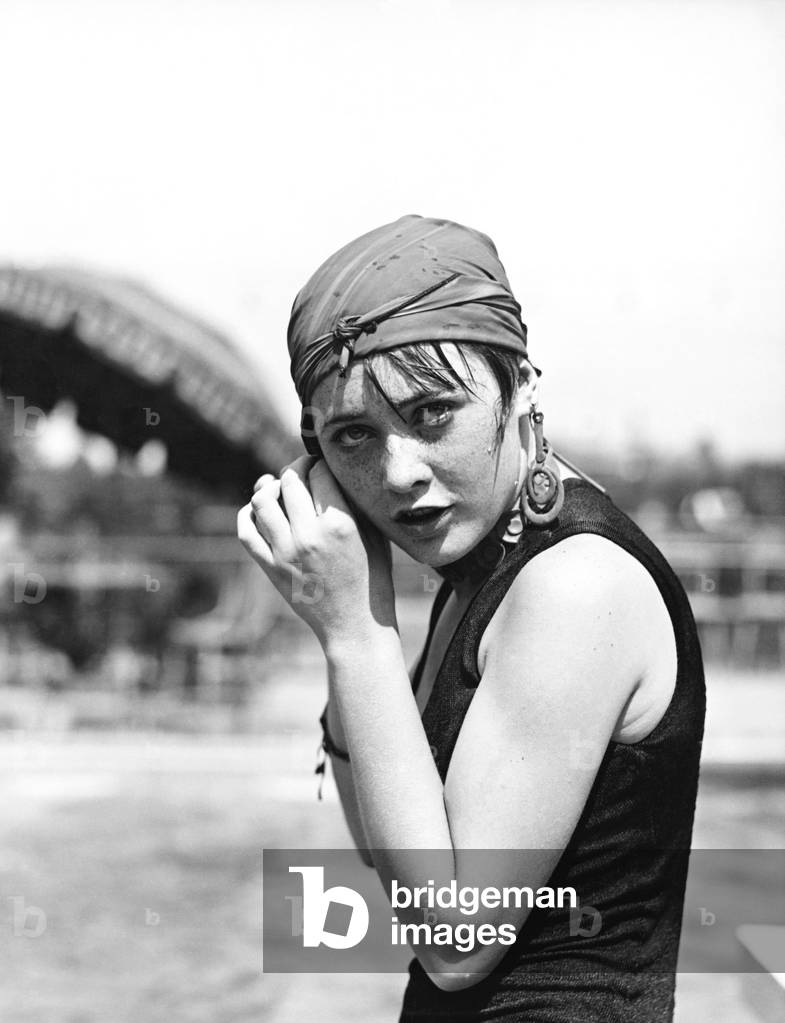 Portrait of a Woman Wrapping a Scarf on her Head