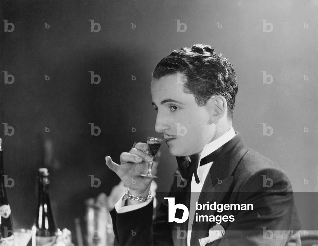 Man Drinking Glass of Liqueur