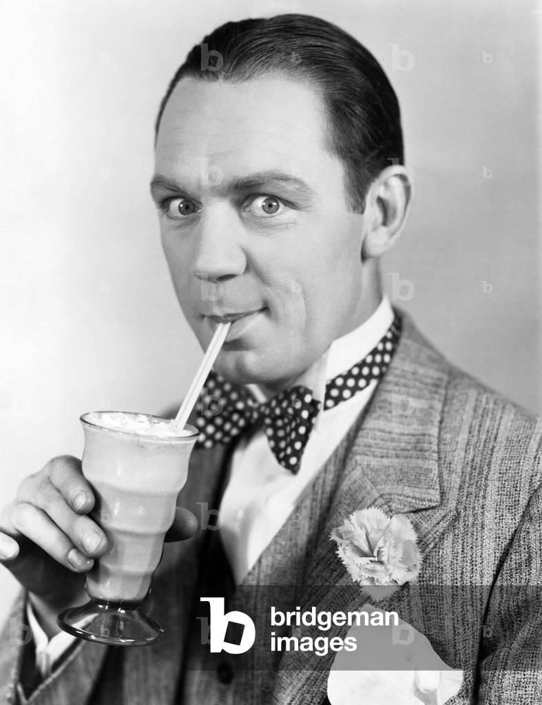 Portrait of Man Drinking Through Straw