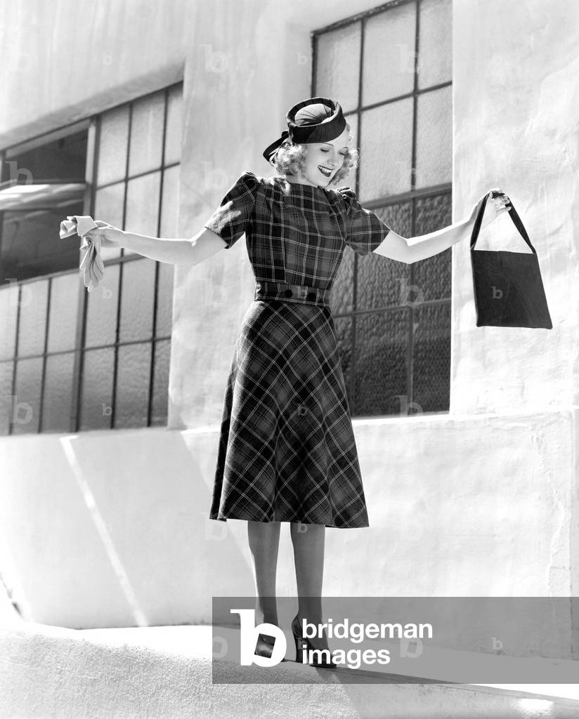Woman Balancing on Edge of Wall