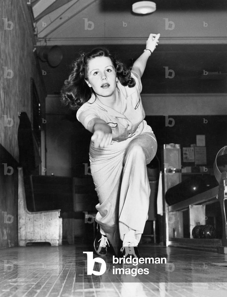 Young Woman Playing Bowling