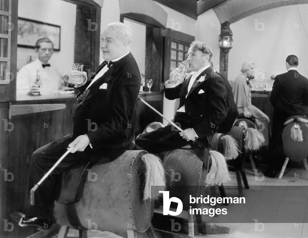 Men Sitting at a Bar on Horse Back