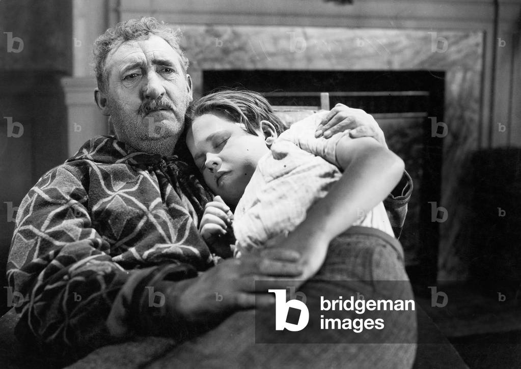 Boy Sleeping on his Grandfather's Lap