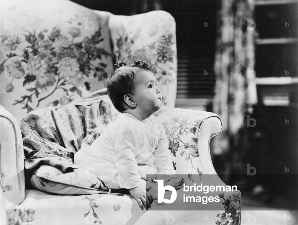 Baby Sitting on Armchair