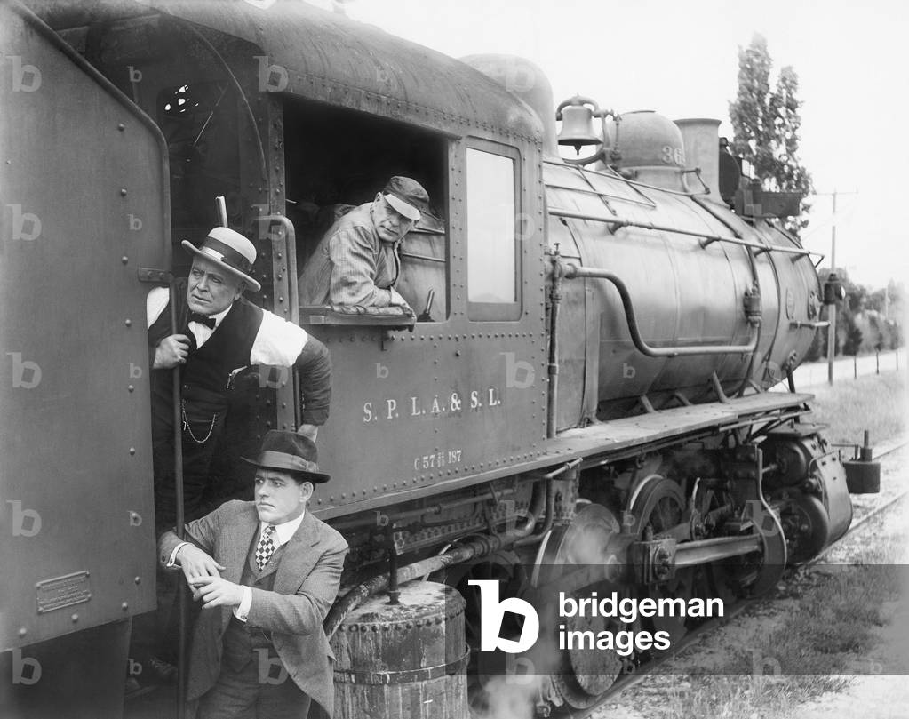 Three Men Waiting at a Steam Locomotive