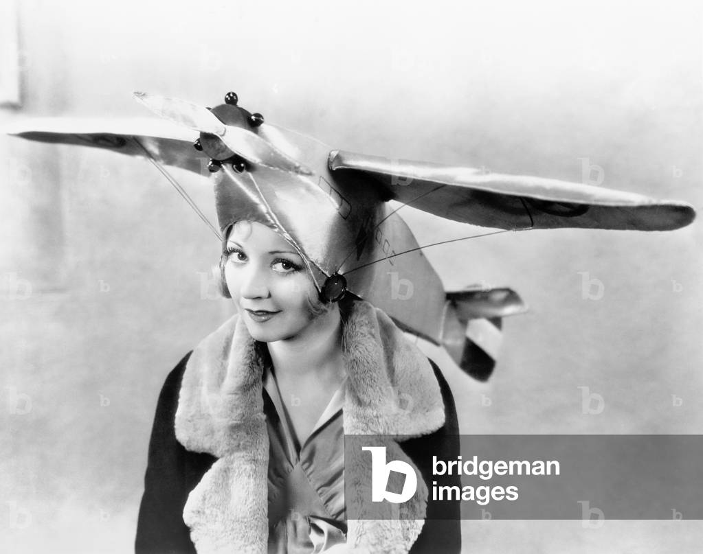 Portrait of a Young Woman Wearing an Airplane Shaped Cap