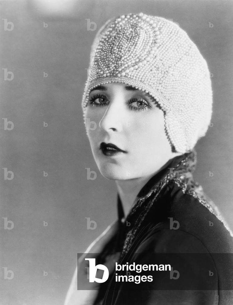 Young Woman in Beaded Cap