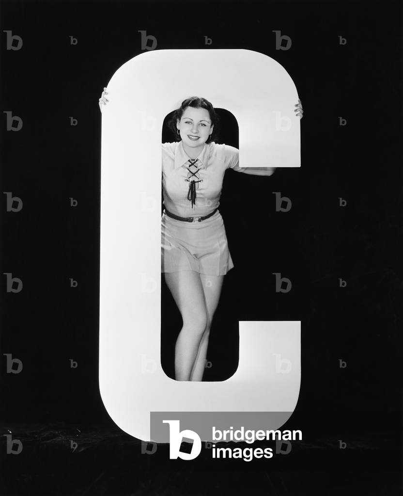 Woman Posing with Huge Letter C