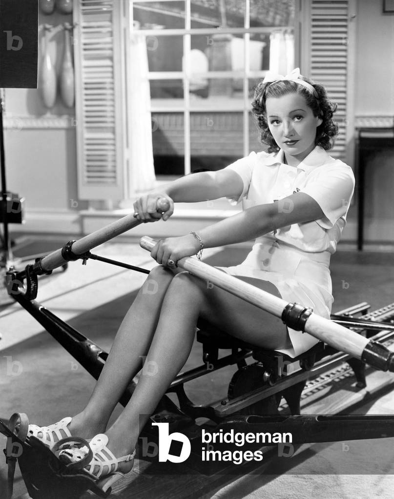 Woman Using Rowing Machine